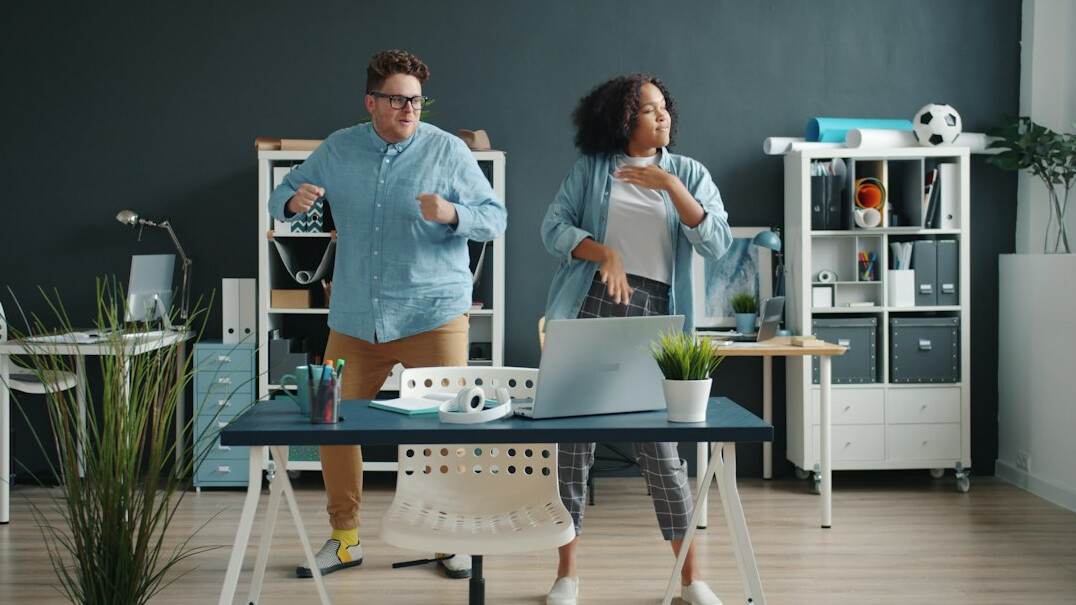 team stretching in office