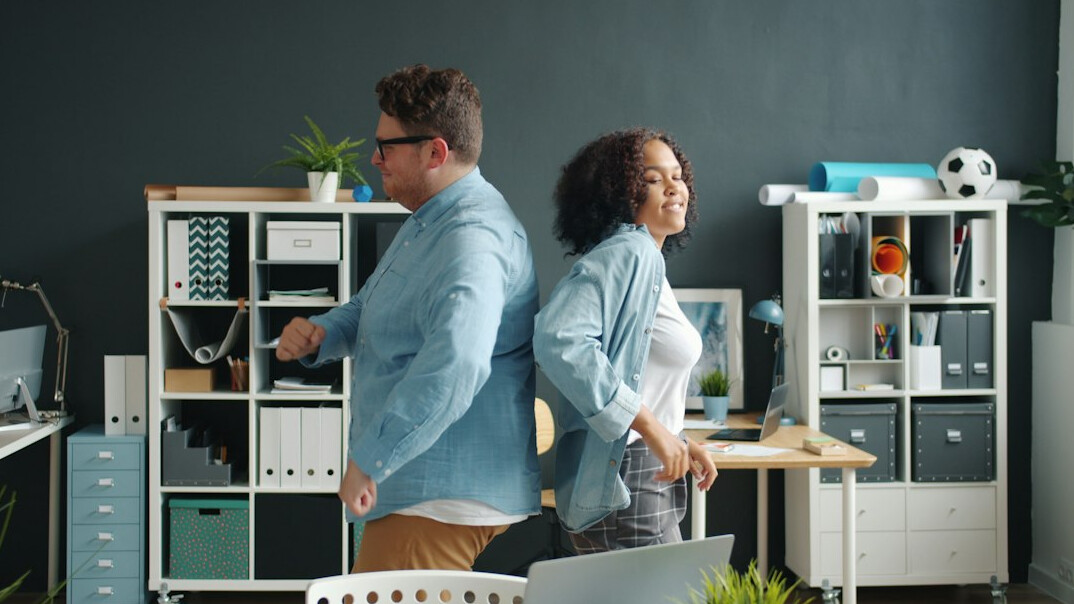 person stretching at desk